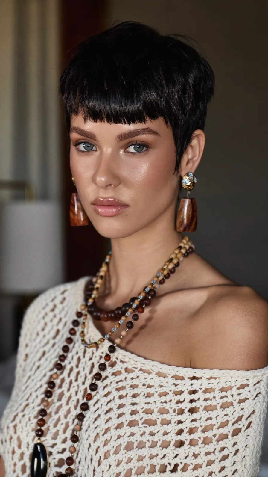 Sleek Jet Black Blunt Pixie Cut with Bold Bangs