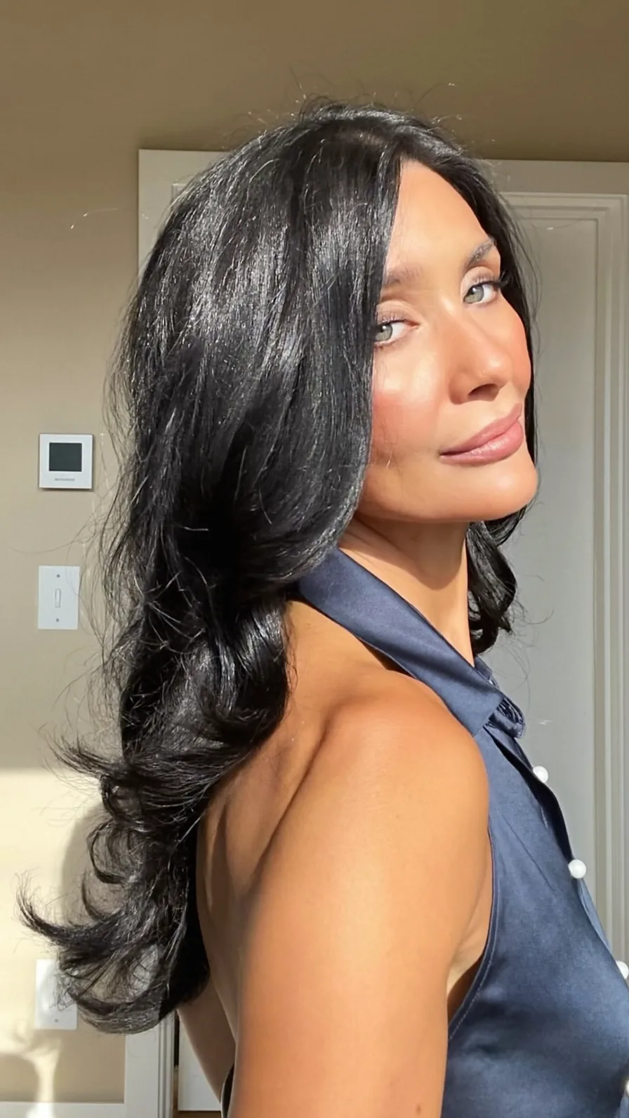 Elegant Long Layered Hair with Side-Swept Flicked Ends