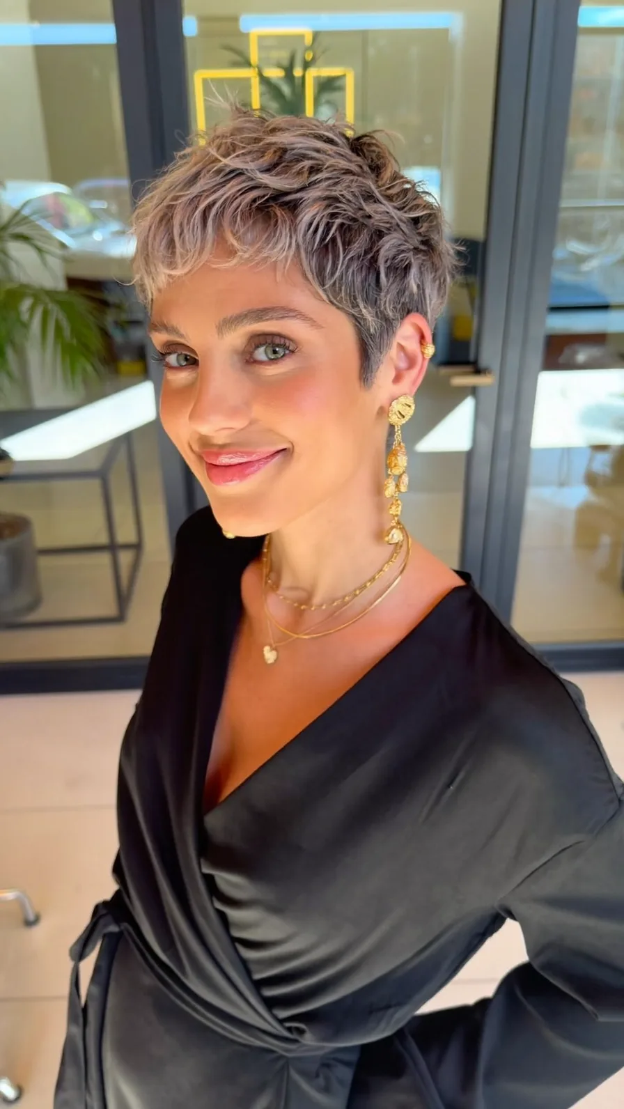 Textured Ashy Blonde Pixie Cut with Choppy Layers and Short Bangs