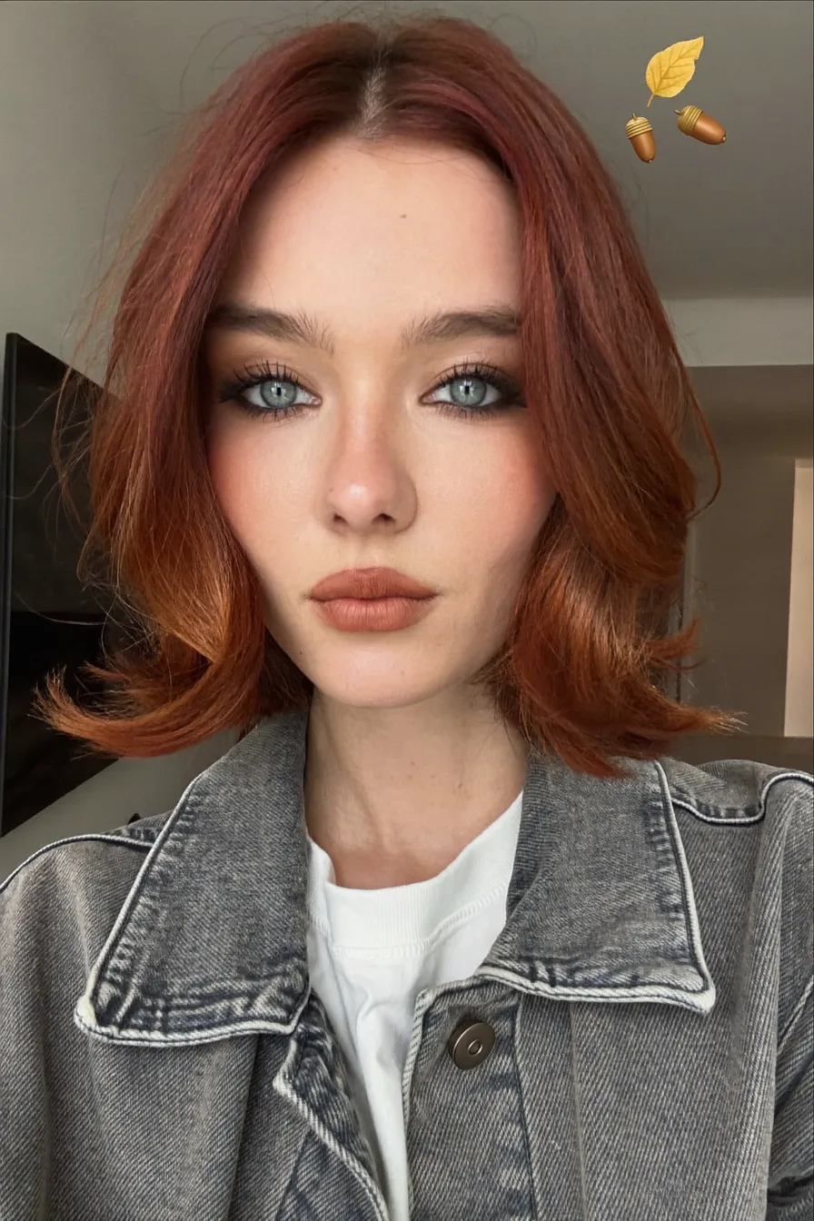 Elegant Center-Parted Layered Bob with Warm Copper Tones