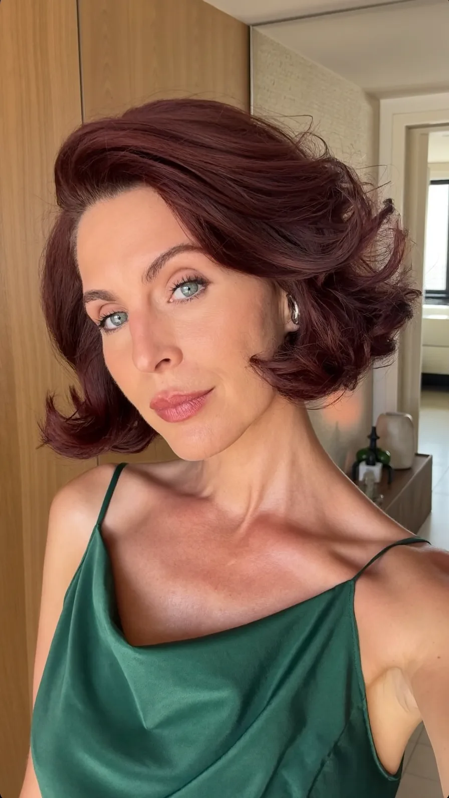 Chin-Length Voluminous Burgundy Bob with Flicked Ends