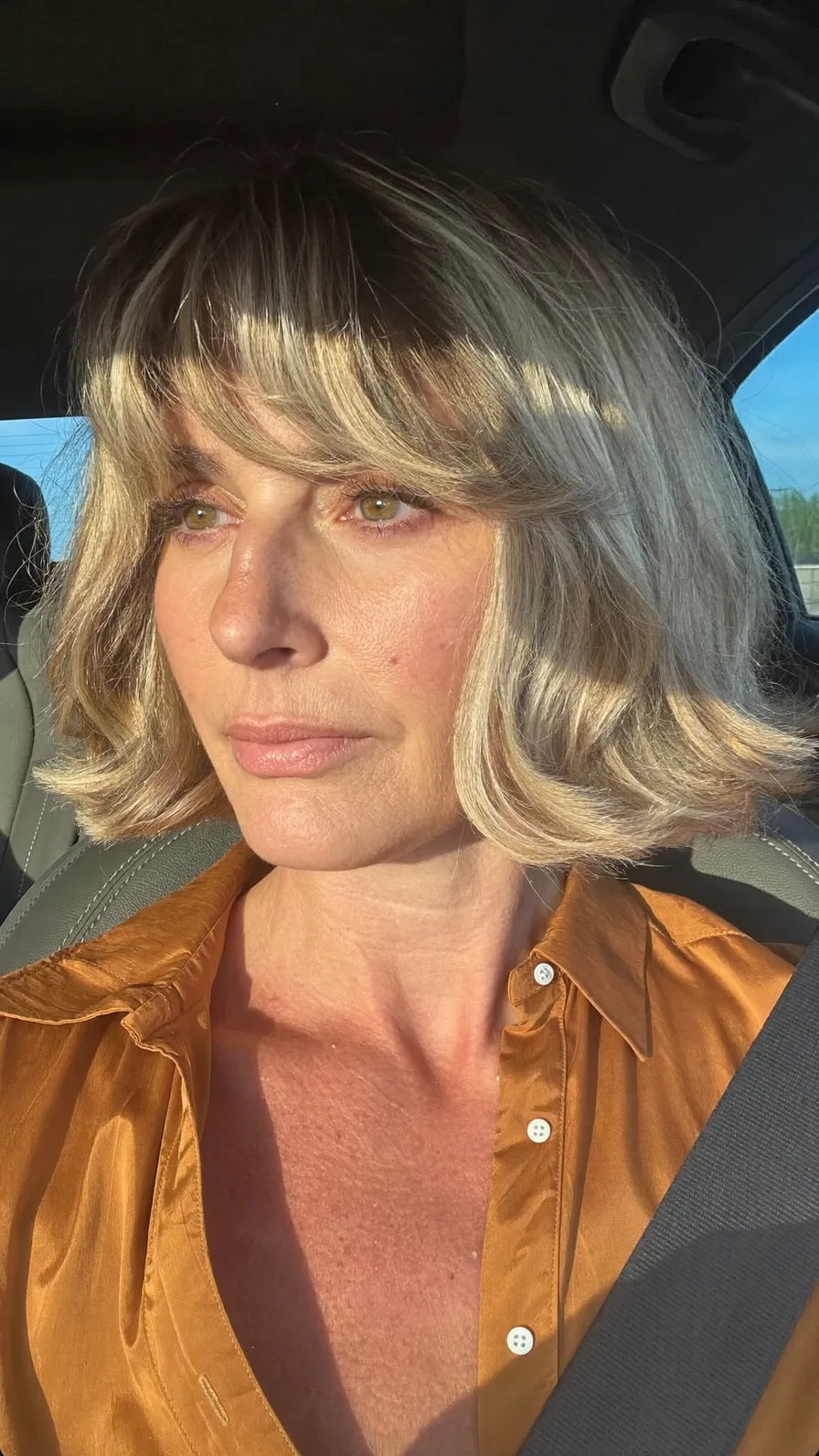 Elegant Chin-Length Bob with Curtain Bangs and Flicked Ends