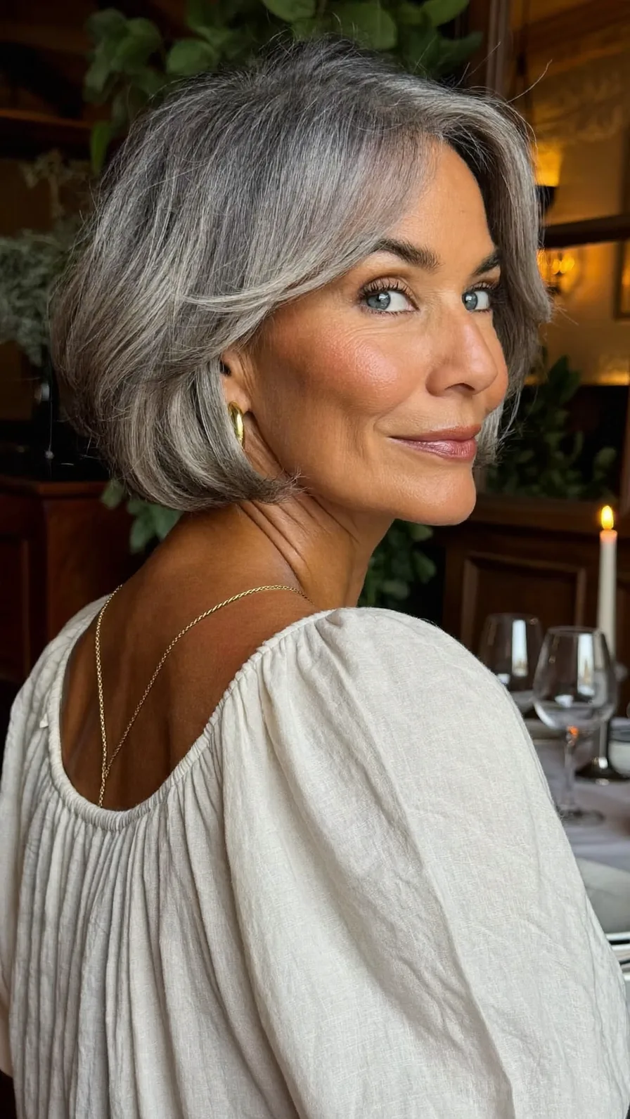 Elegant Chin-Length Bob with Side-Swept Layers for Gray Hair