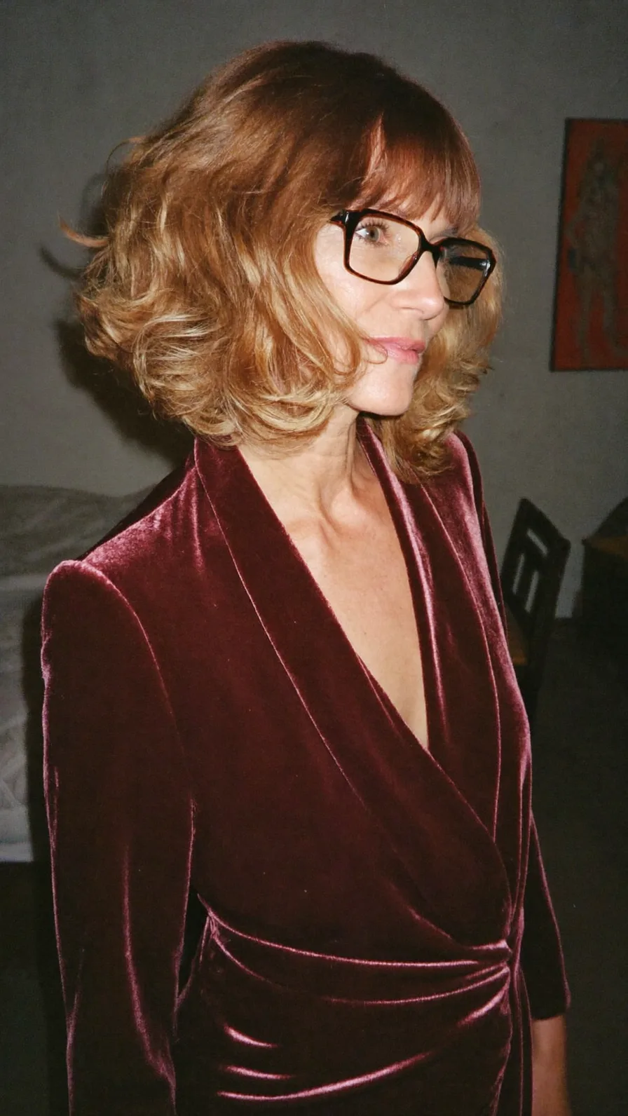 Voluminous Layered Bob with Blunt Bangs and Warm Highlights