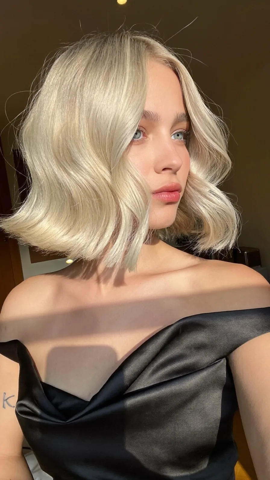 Chic Platinum Blonde Blunt Bob with Side-Swept Waves