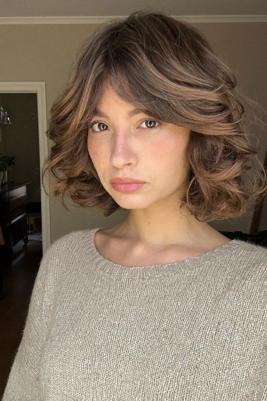 Voluminous Chin-Length Layered Bob with Curtain Bangs