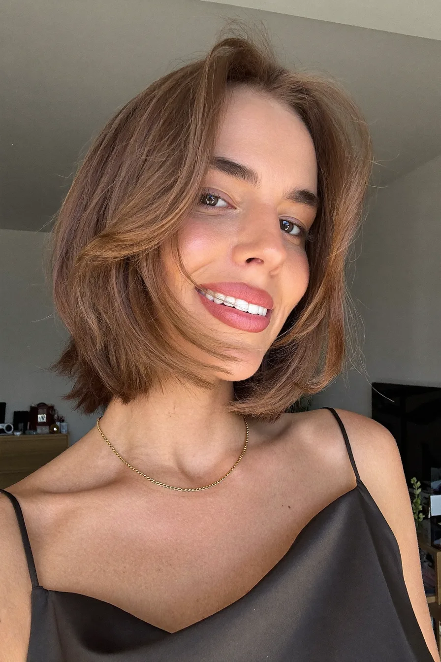 Soft Flowing Chin-Length Bob with Warm Chestnut Curtain Bangs