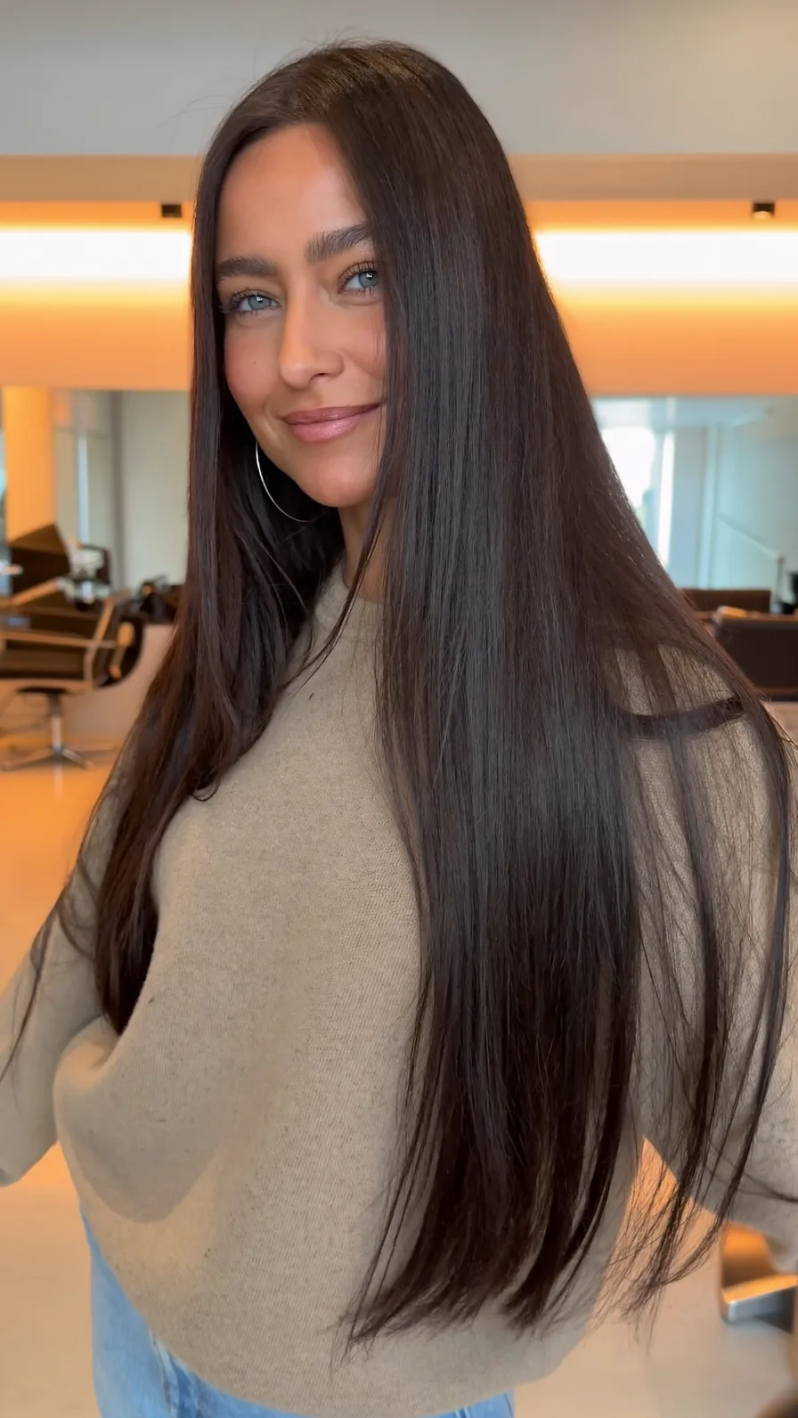 Sleek Long Layers with Center Part for Timeless Look