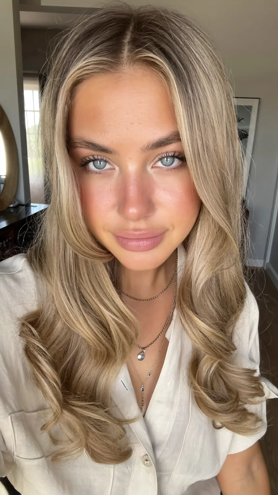 Long Layered Ash Blonde Hair with Curtain Bangs