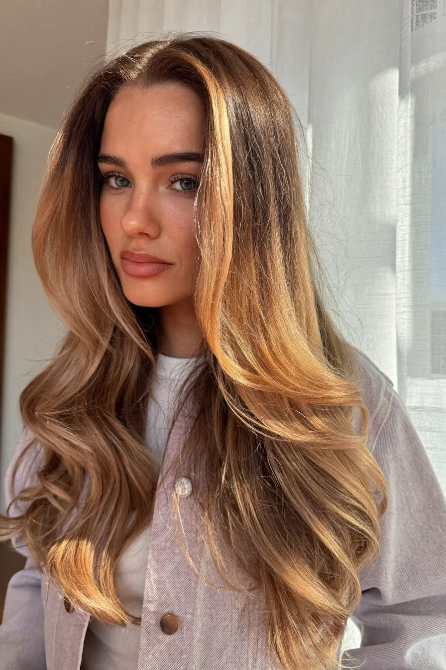 Long Layered Hair with Balayage and Flowing Waves
