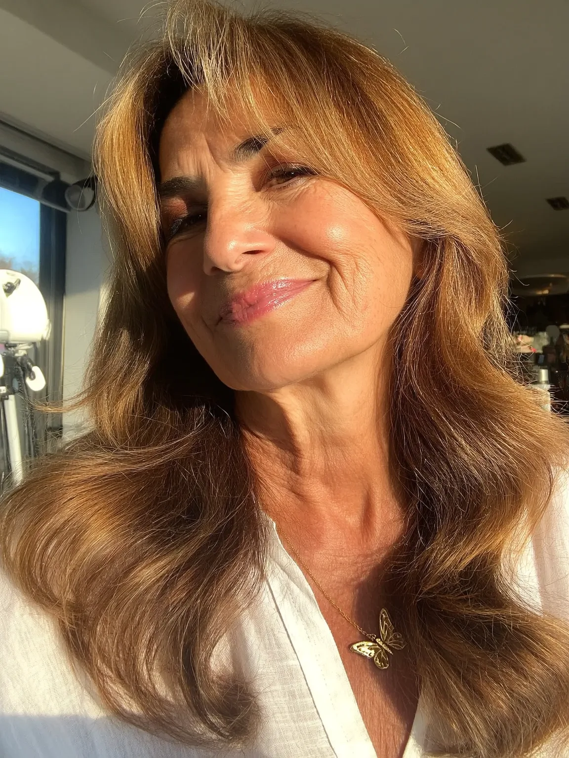Long Golden Caramel Brown Wavy Layers with Curtain Bangs