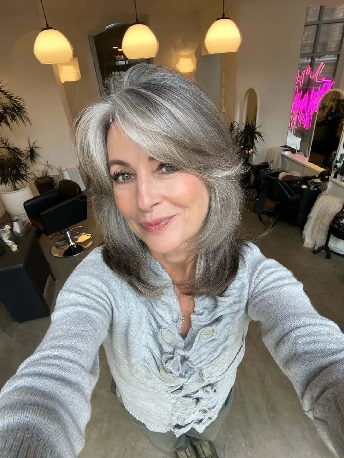 Shoulder-Length Silver Frost Layers with Dark Roots and Side Bangs