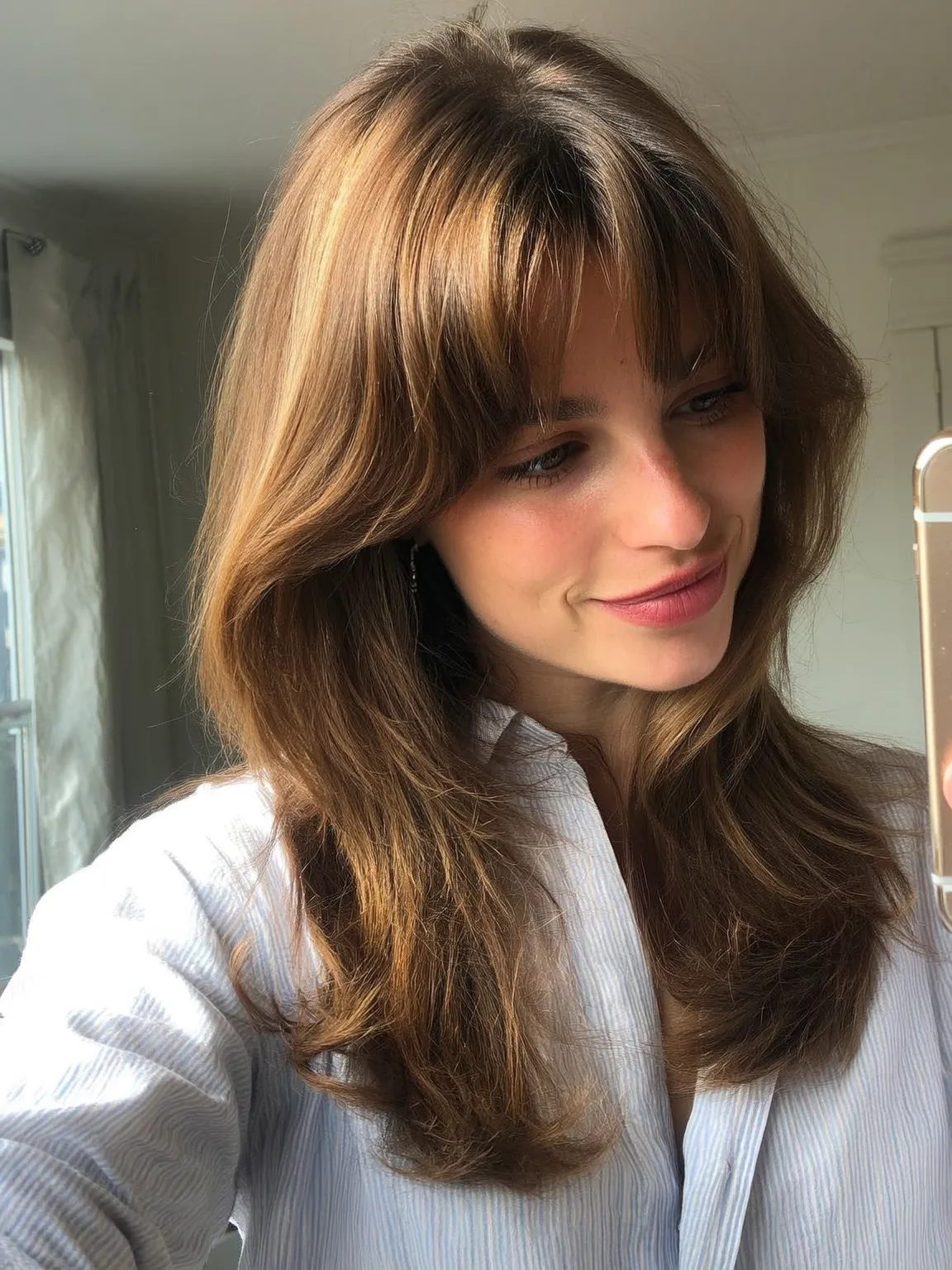 Medium-Length Wavy Warm Caramel Layers with Side-Swept Bangs