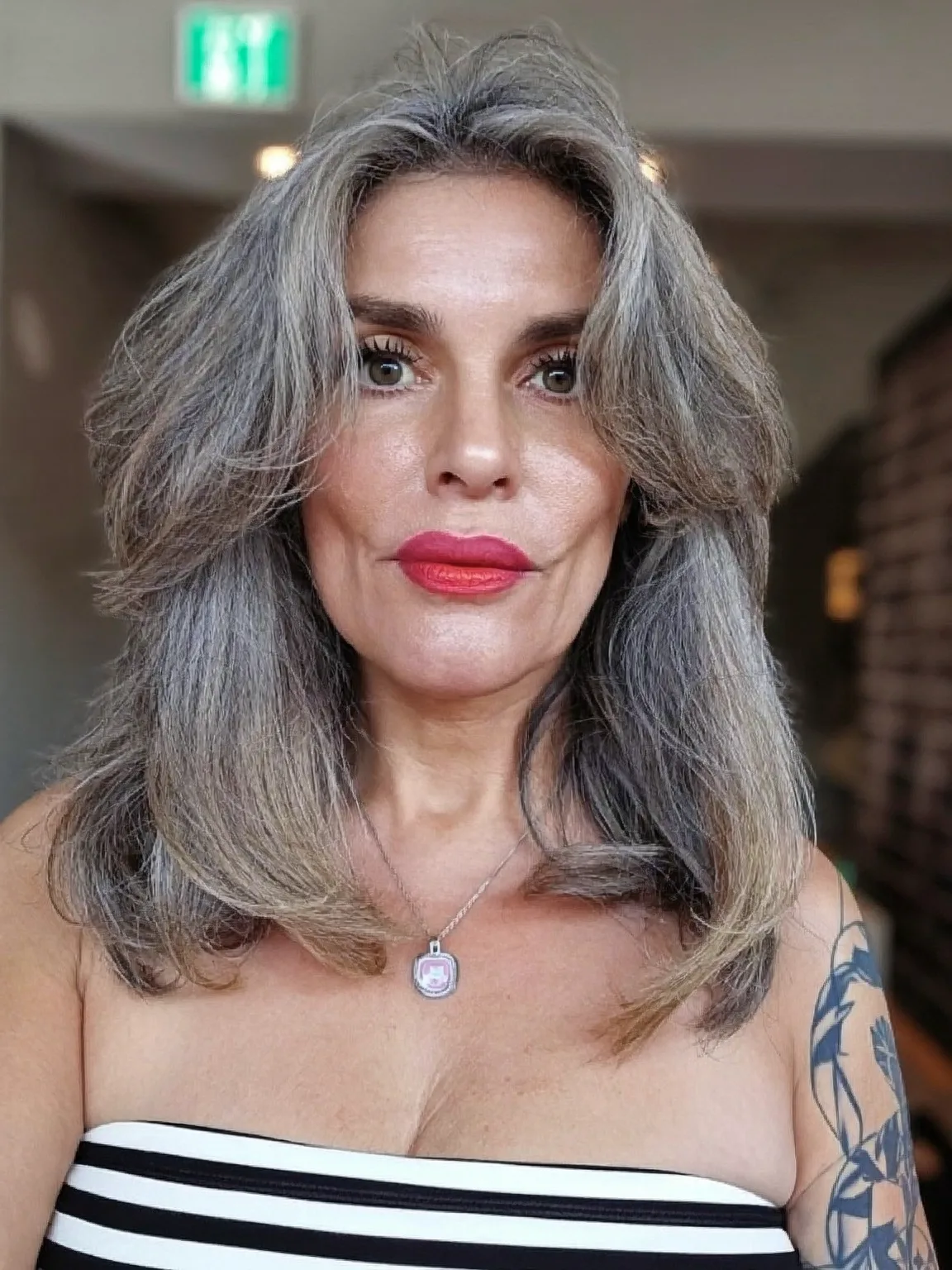 Voluminous Salt and Pepper Wavy Layers Medium Length