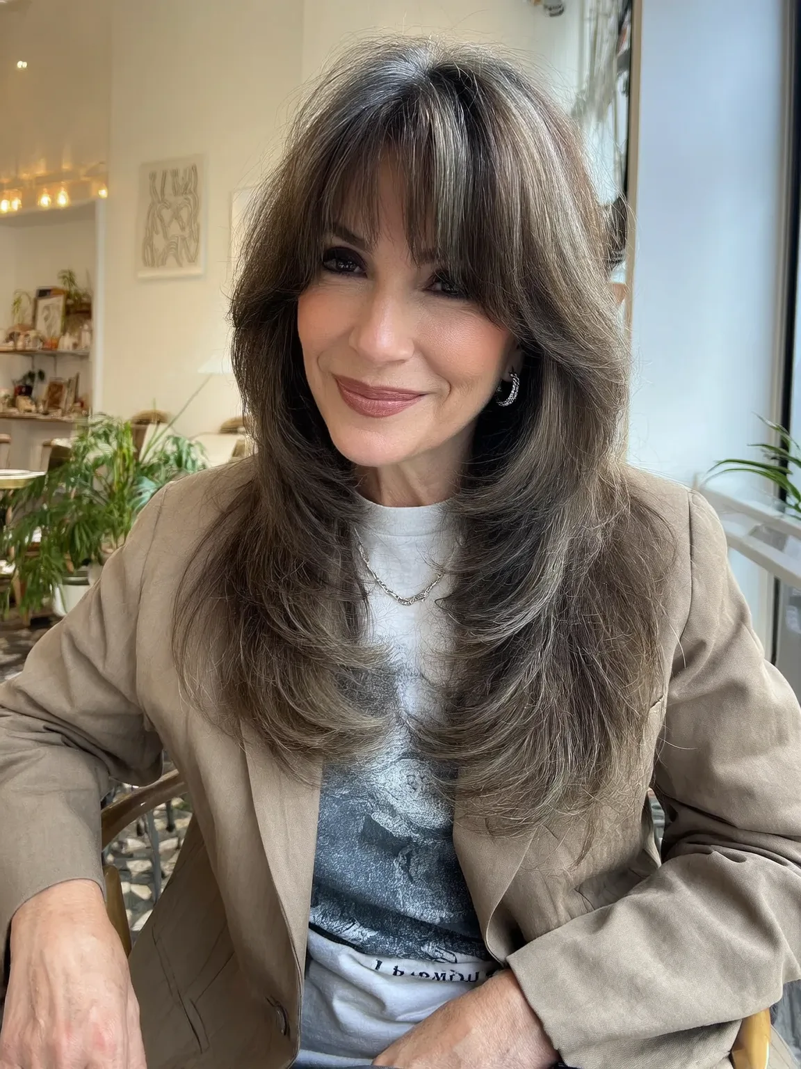 Long Ashy Brown Layers with Delicate Curtain Bangs