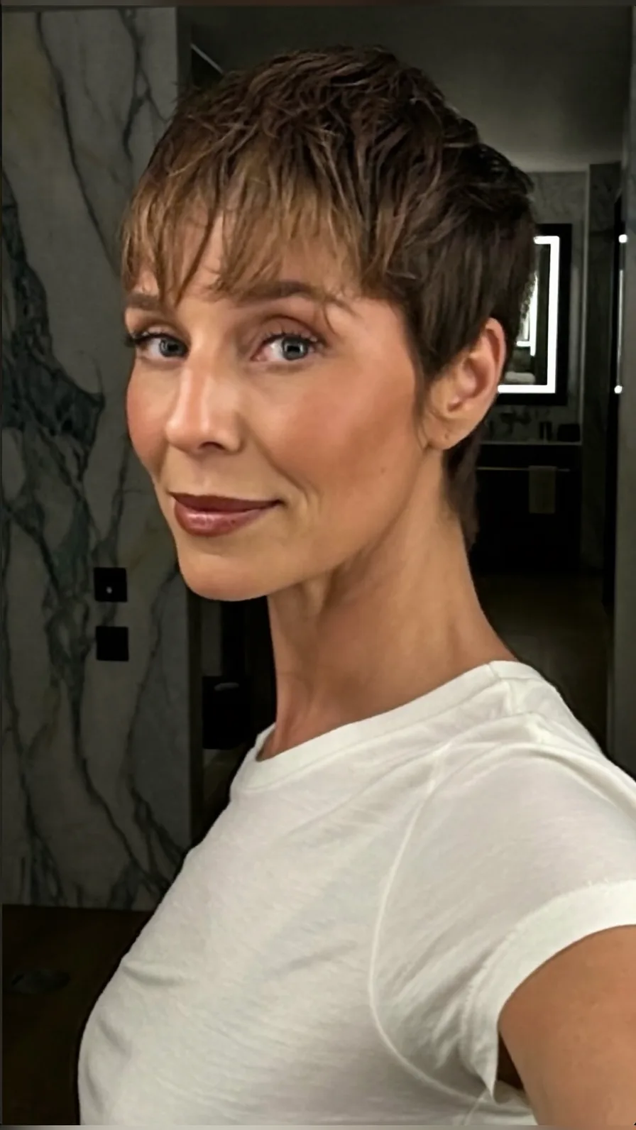 Chic Textured Pixie Cut with Wispy Side Swept Bangs