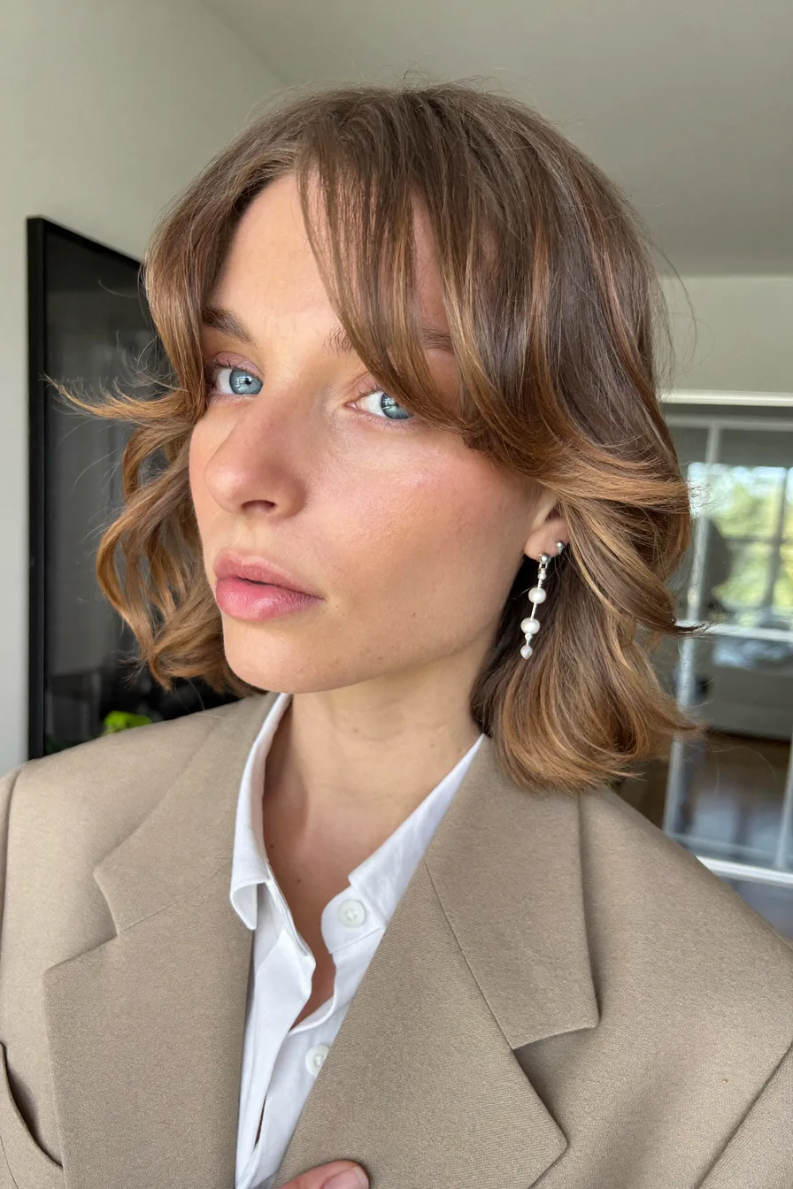 Elegant Chin-Length Layered Bob with Soft Curtain Bangs