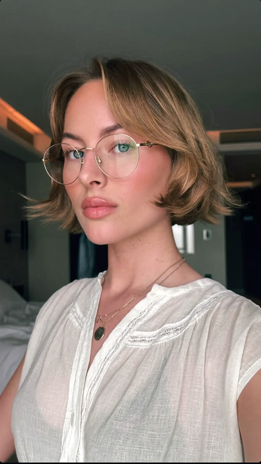 Chin-Length Flowy Bob with Curtain Bangs and Flicked Ends
