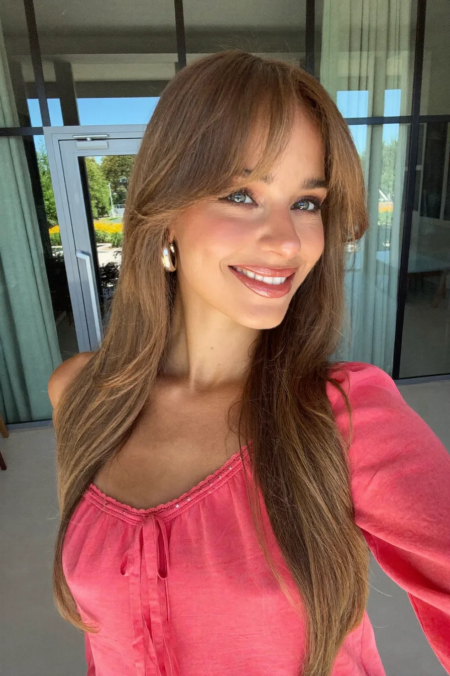 Elegant Long Layered Hair with Soft Curtain Bangs