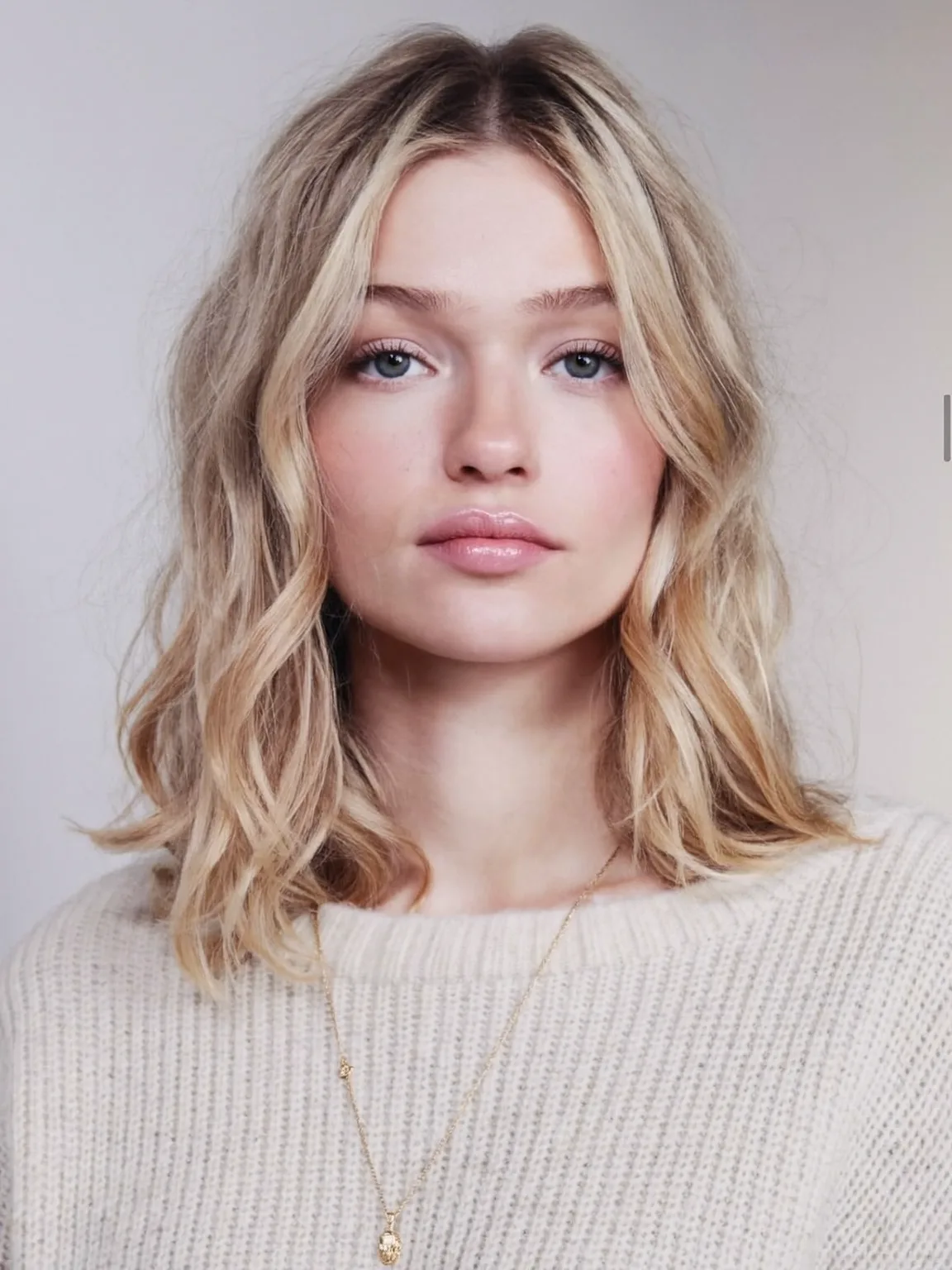 Sandy Blonde Wavy Lob with Curtain Bangs