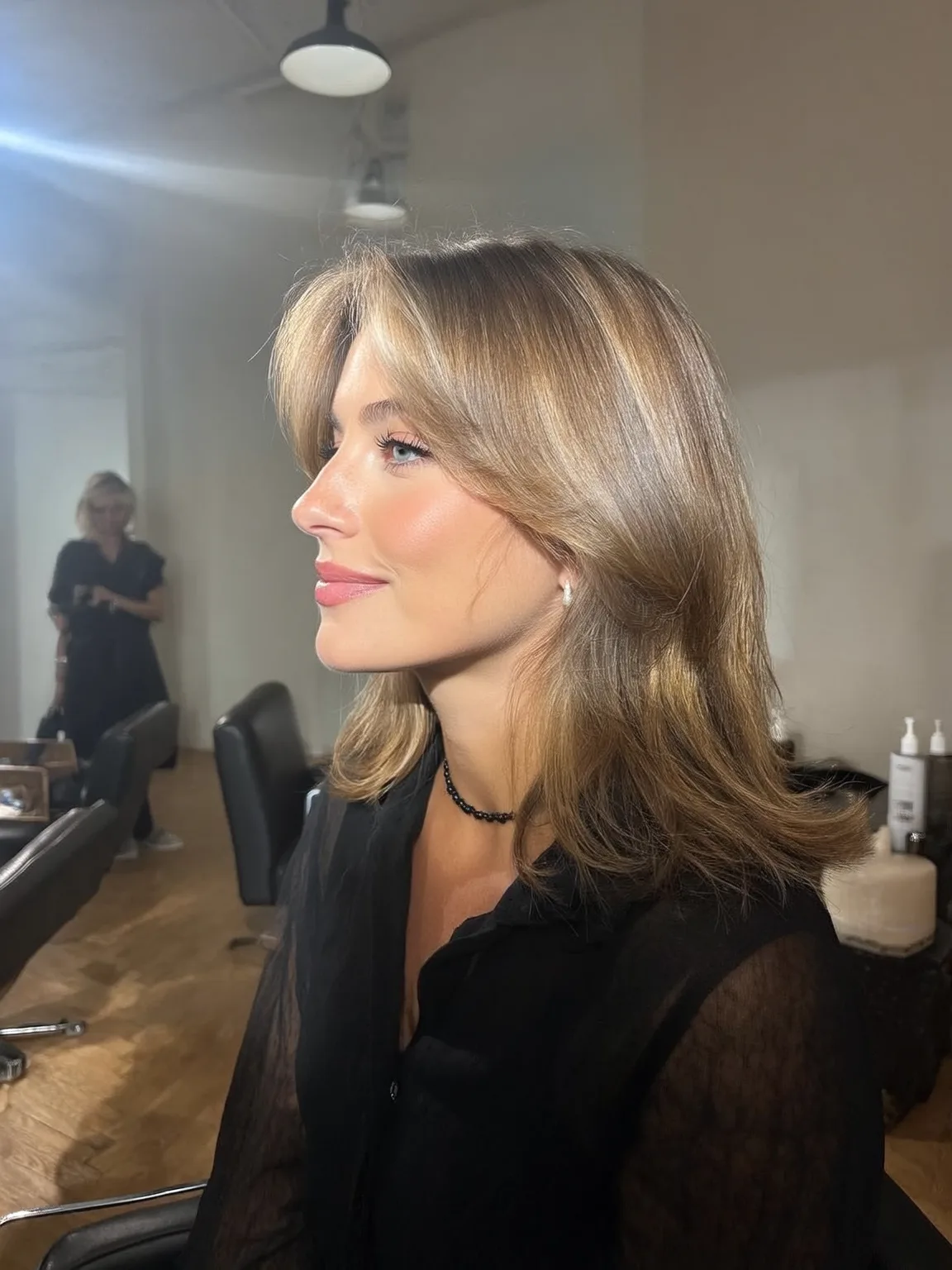 Soft Curtain Bangs with Flowing Sandy Blonde Layers