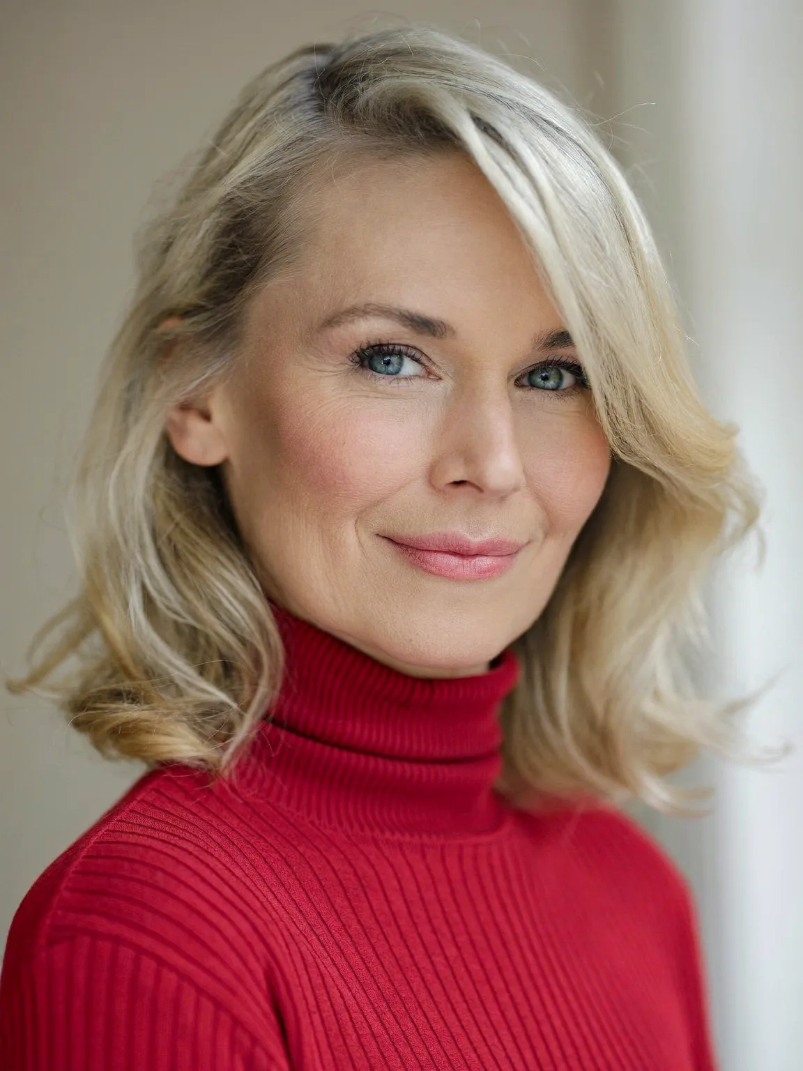 Wavy Sandy Blonde Lob with Side-Swept Bangs