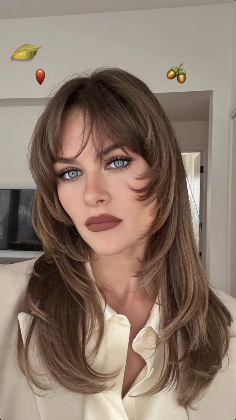 Long Feathered Layers with Curtain Bangs and Flowing Style