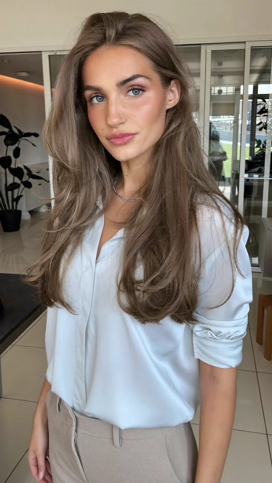 Elegant Long Layered Ash Brown Hairstyle with Flowing Texture