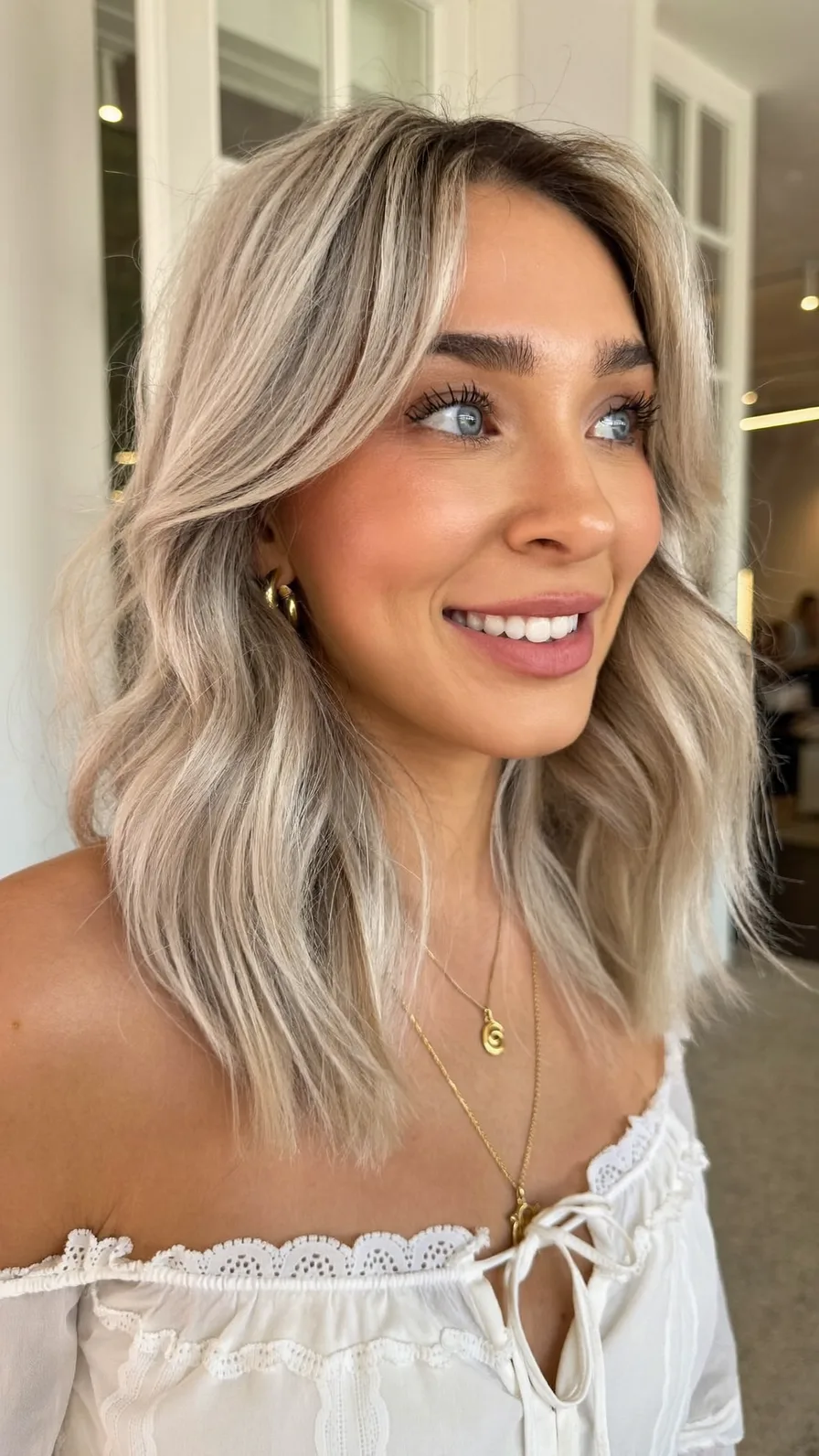Modern Shoulder-Length Layered Lob with Curtain Bangs