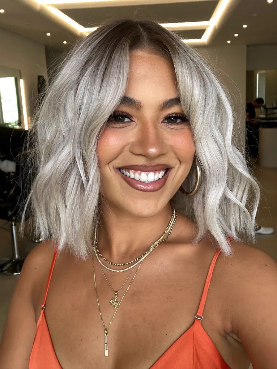 Voluminous Cool Ash Blonde Lob with Curtain Bangs
