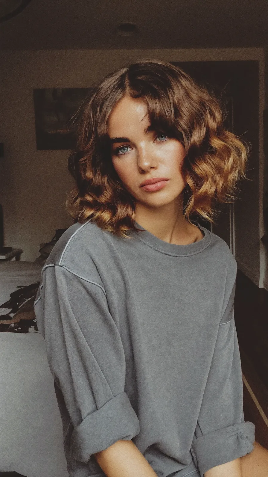 Soft Wavy Lob with Curtain Bangs and Caramel Balayage Highlights