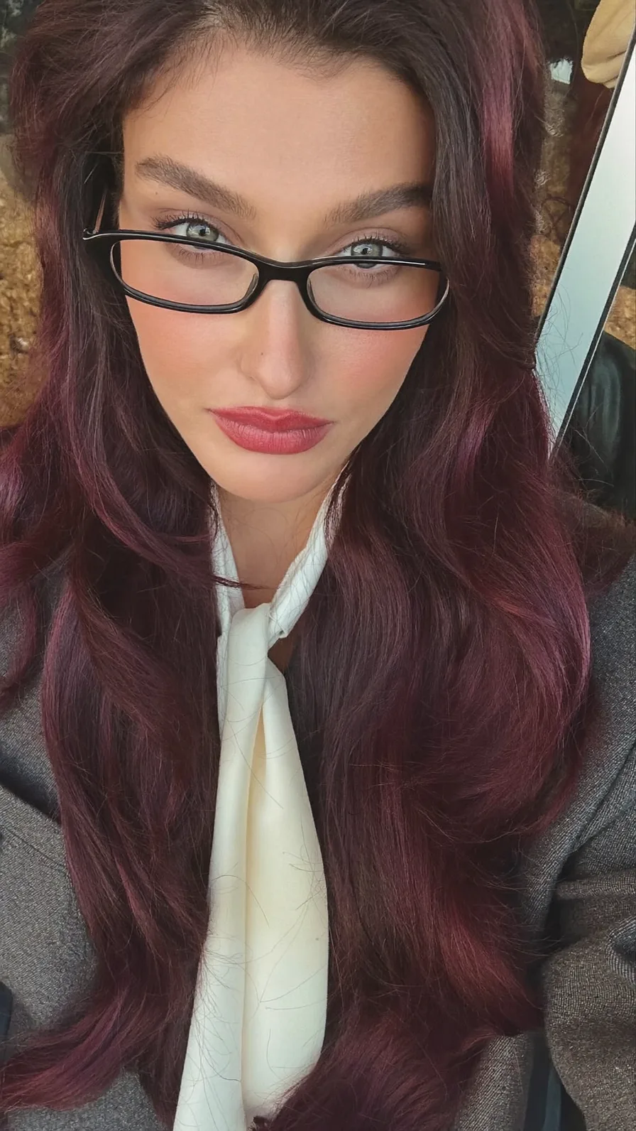 Long Layered Burgundy Waves with Soft Side-Swept Bangs