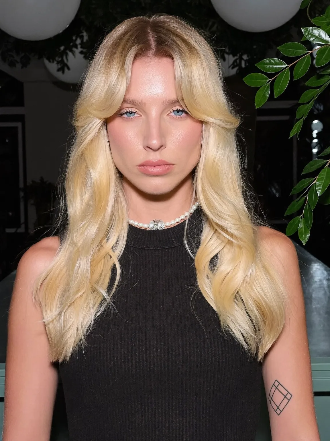 Voluminous Buttery Blonde Wavy Layers with Fringed Bangs