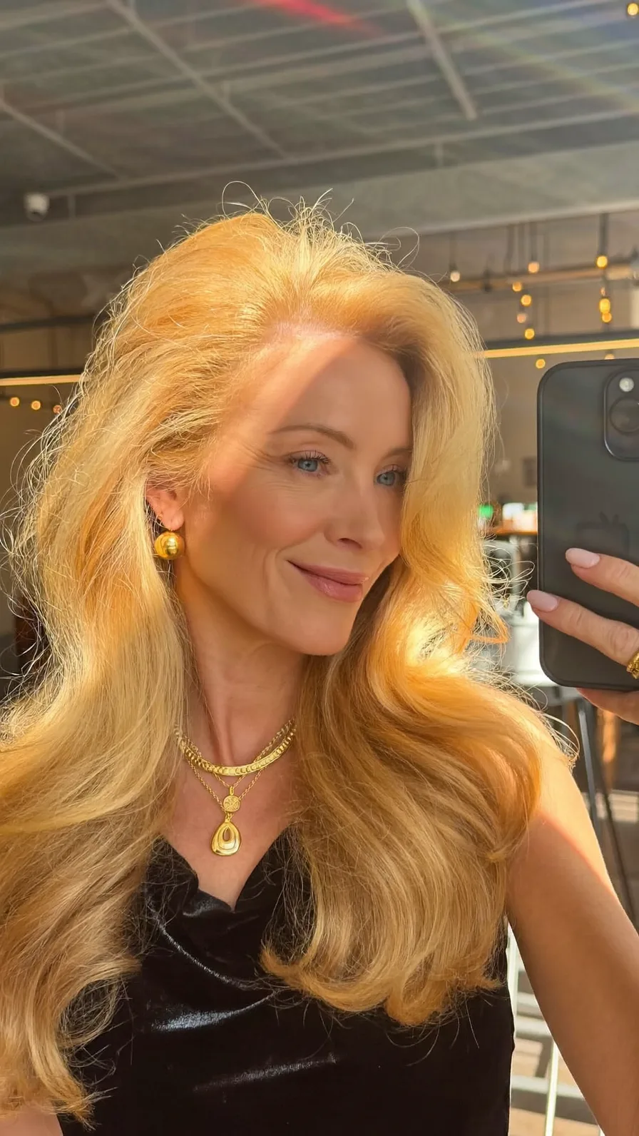 Golden Blonde Voluminous Long Layered Hairstyle with Side Part