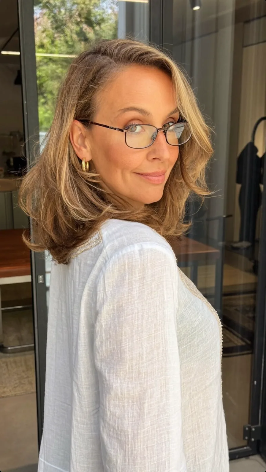 Voluminous Layered Blowout with Warm Honey Blonde Balayage