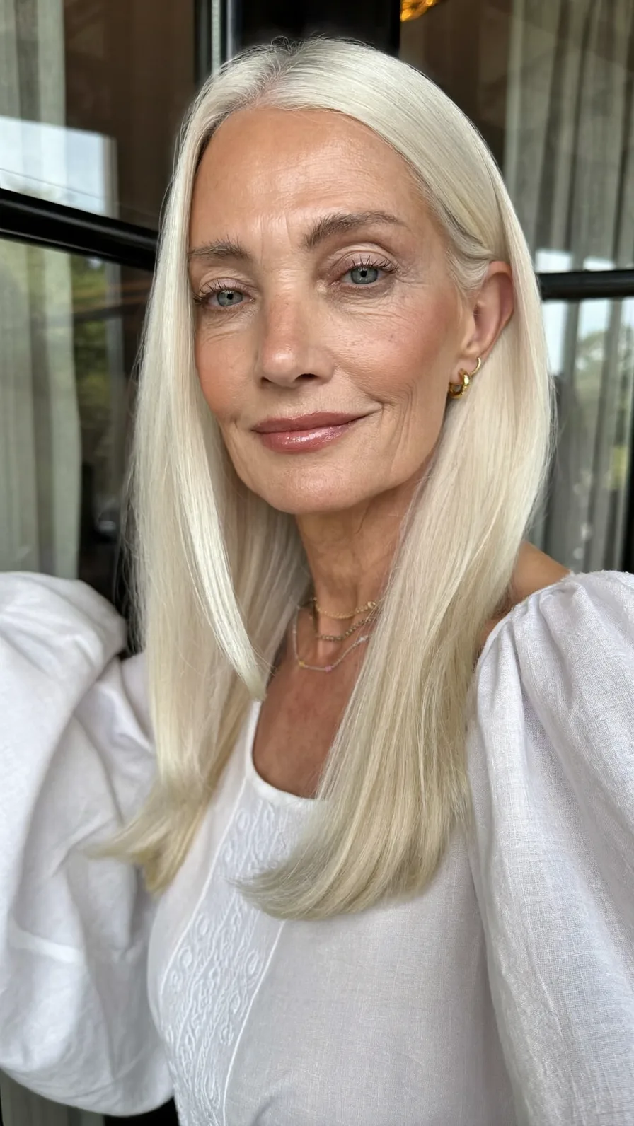 Elegant Long Platinum Blonde Layers with Center Part