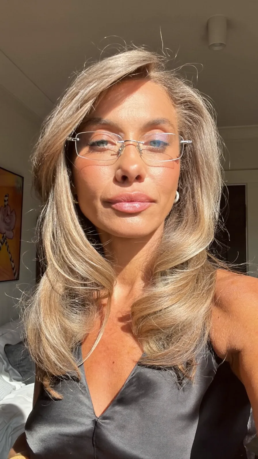 Classic Ash Blonde Shoulder-Length Layered Hairstyle with Side Bangs