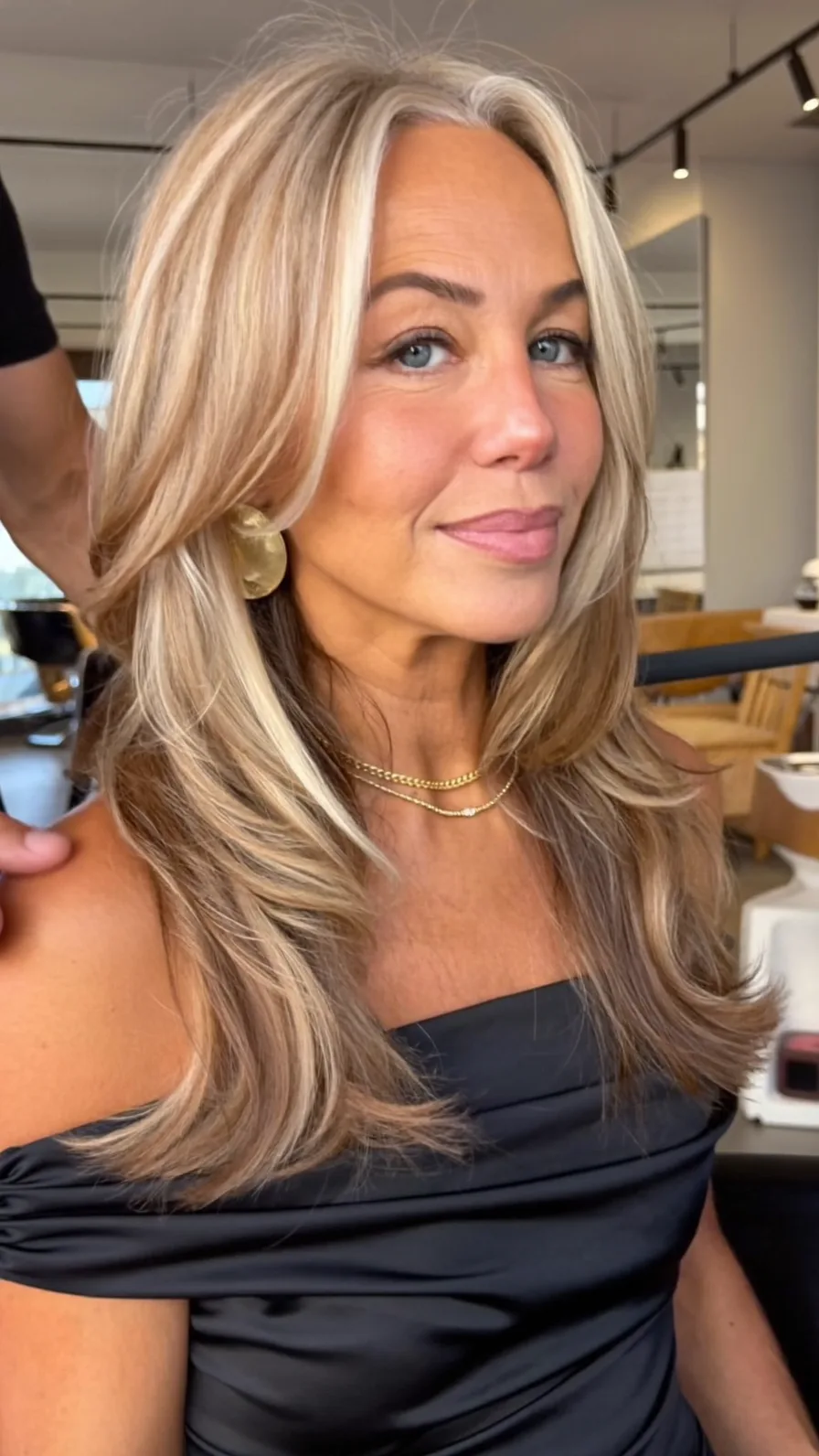 Soft Layered Blonde Balayage with Feathered Face-Framing Layers