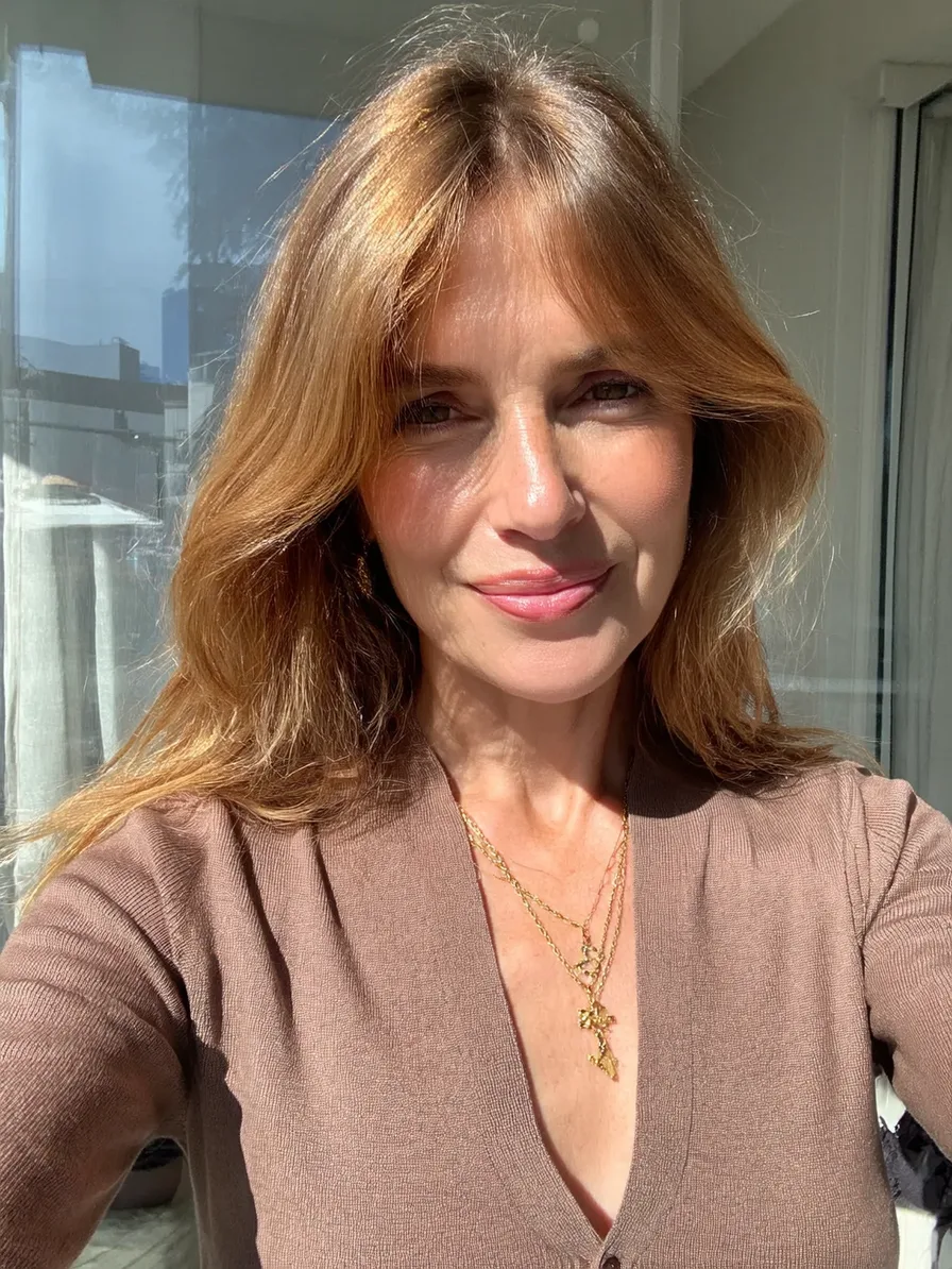 Medium Wavy Hair with Curtain Bangs and Long Feathered Layers