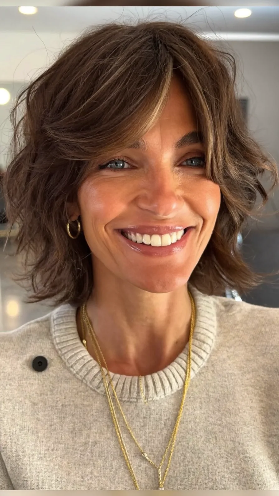 Voluminous Feathered Medium-Length Hair with Curtain Bangs