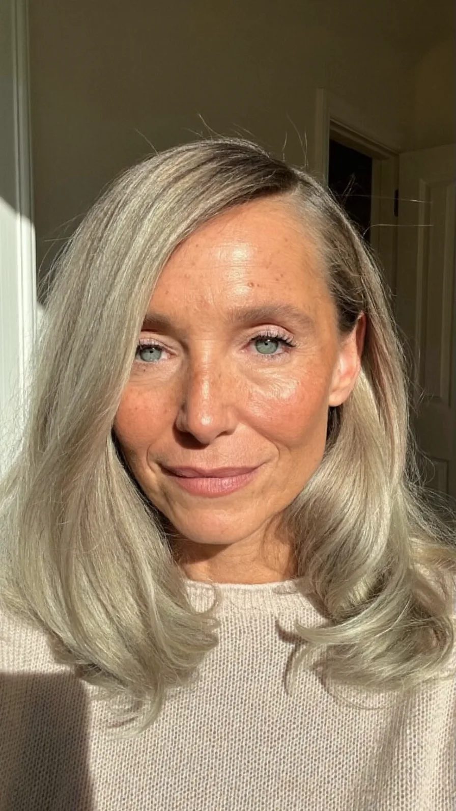 Soft Medium-Length Ash Blonde Hairstyle with Long Layers