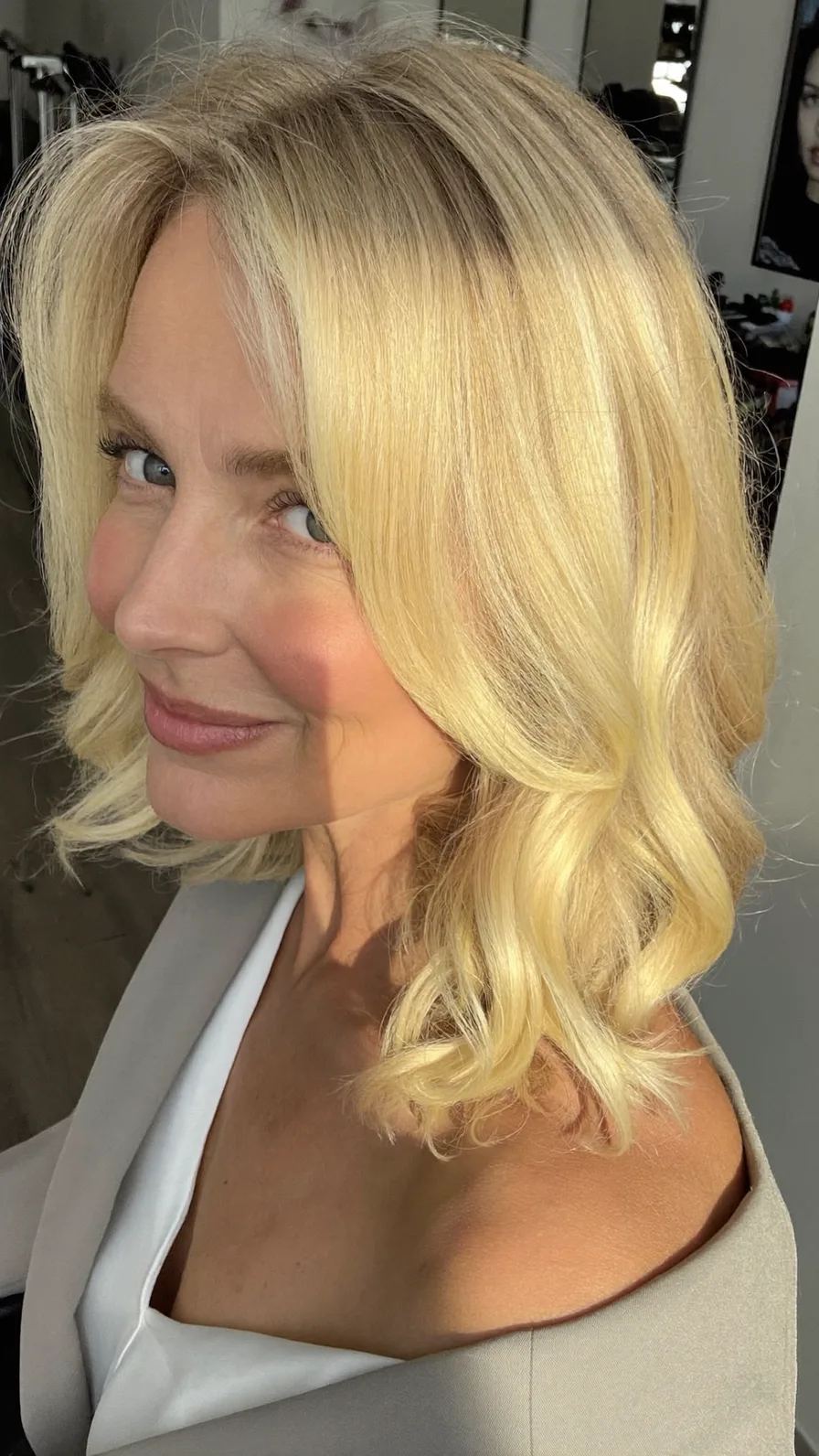 Soft Flowing Shoulder-Length Platinum Blonde with Curtain Bangs