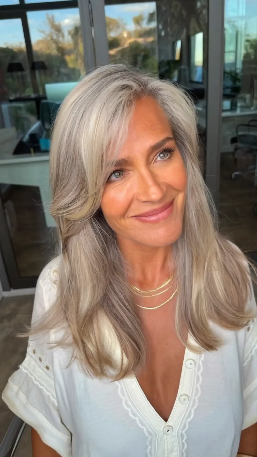 Flowing Platinum Gray Medium Length Long Layered Hairstyle
