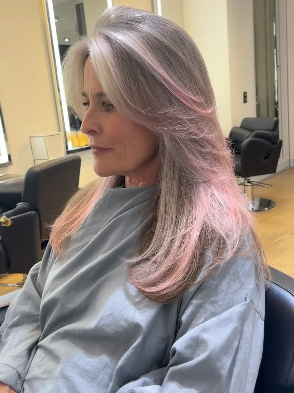 Straight Silver Layers with Pastel Pink Highlights and Side-Swept Bangs