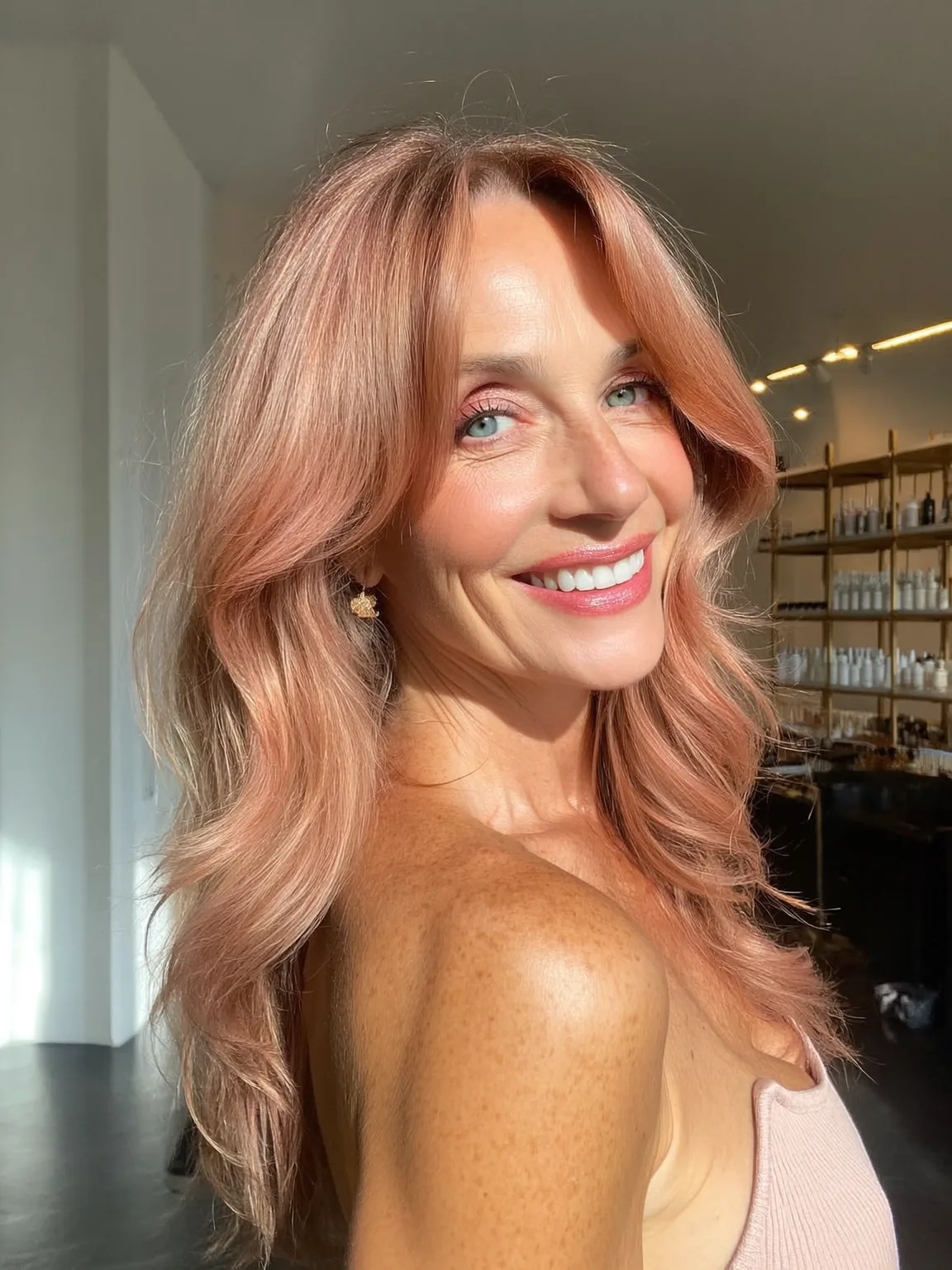 Rose Gold Wavy Layers with Curtain Bangs and Medium Volume