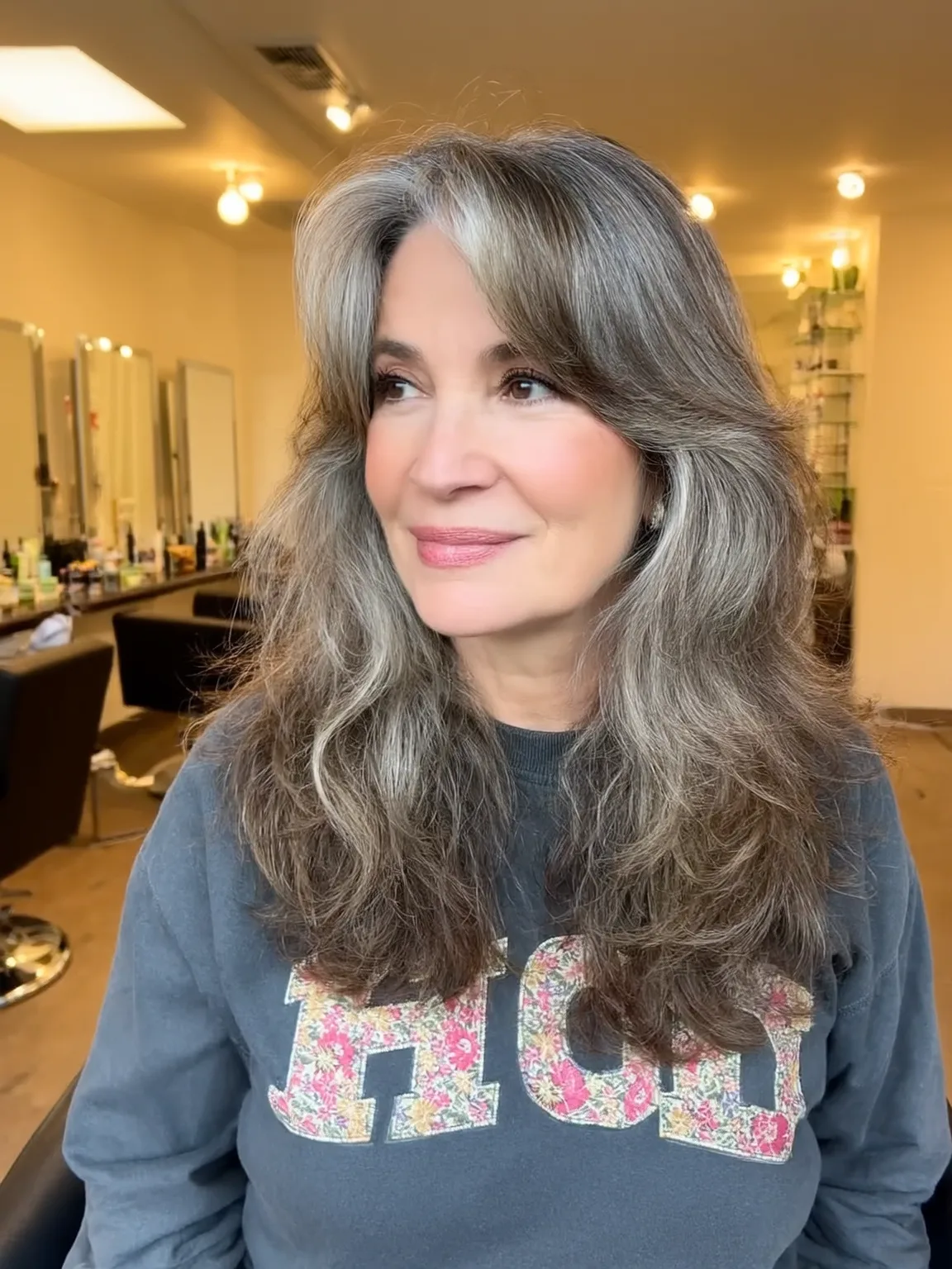 Salt and Pepper Layered Waves with Side-Swept Bangs