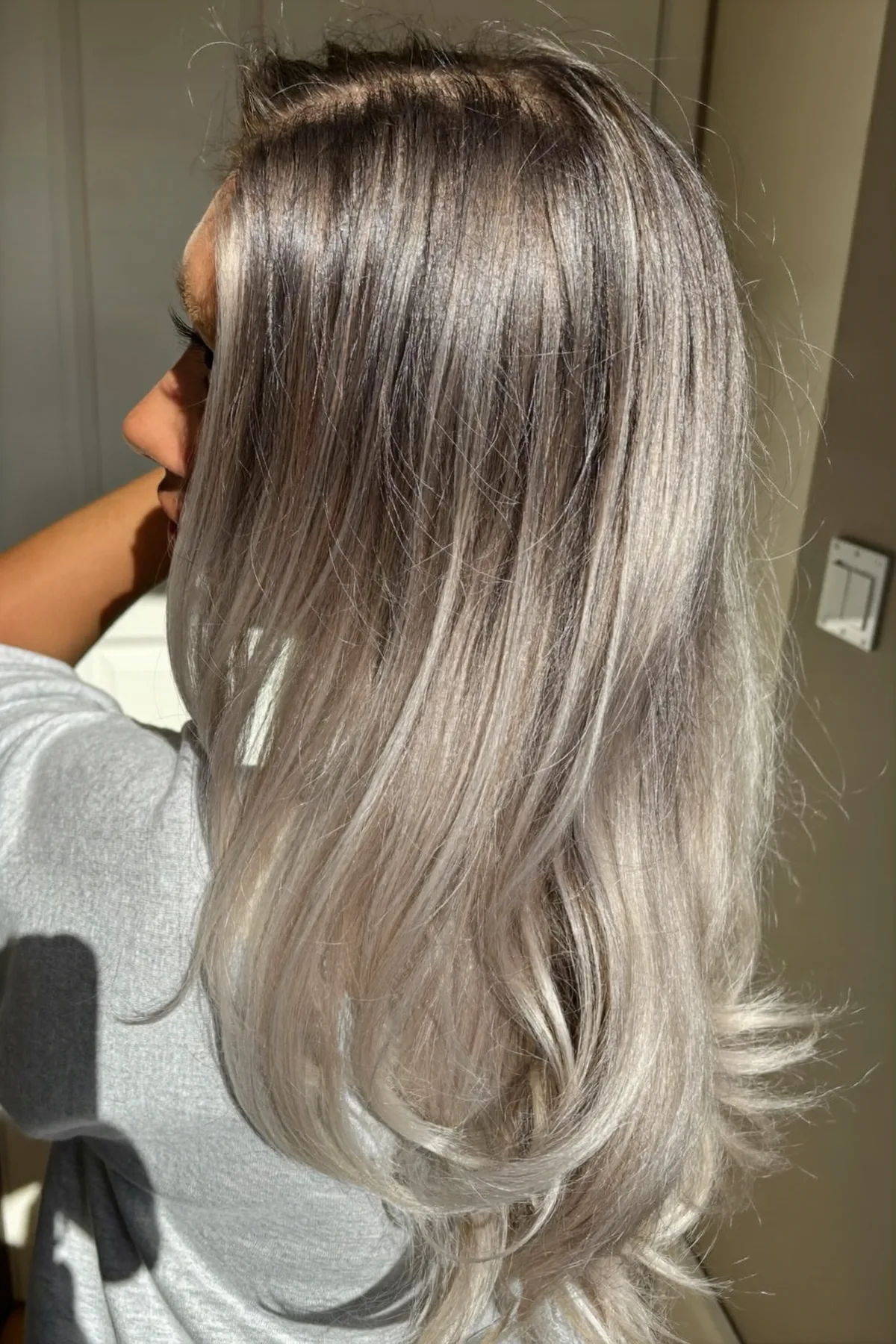 Sleek Silver Gray Long Layered Cut for Mid-Back Length Hair