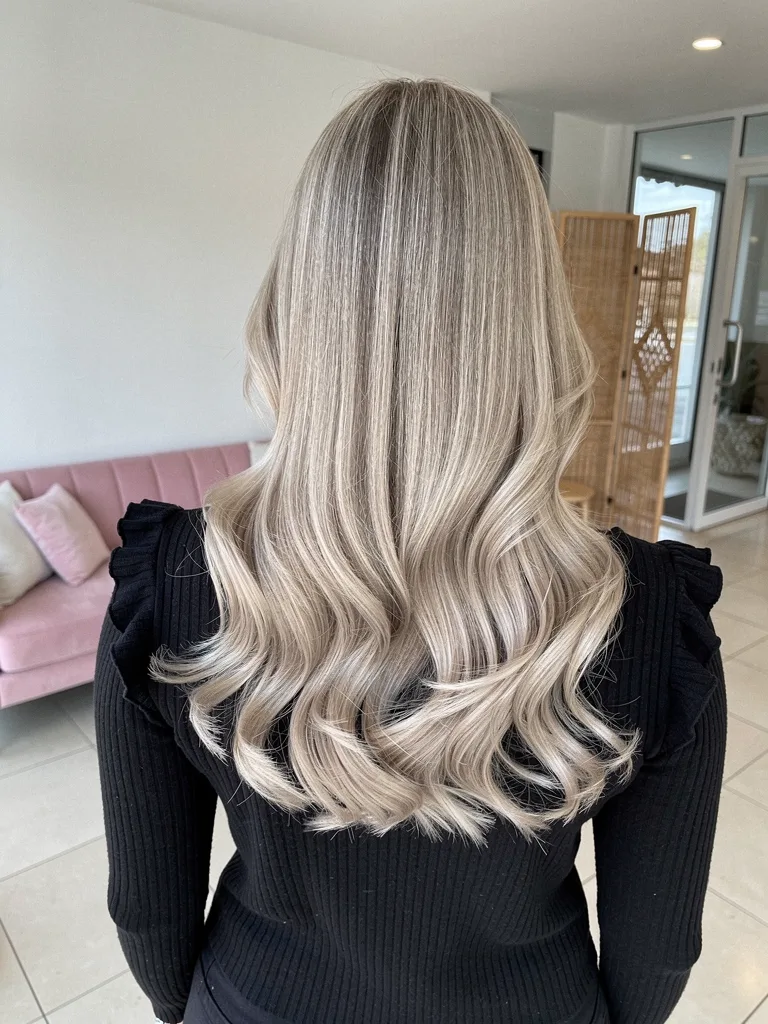 Medium-Volume Sandy Blonde Waves Without Bangs