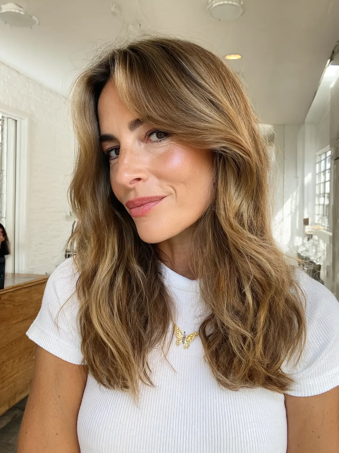 Golden Brown Wavy Layers with Curtain Bangs for Oval Faces