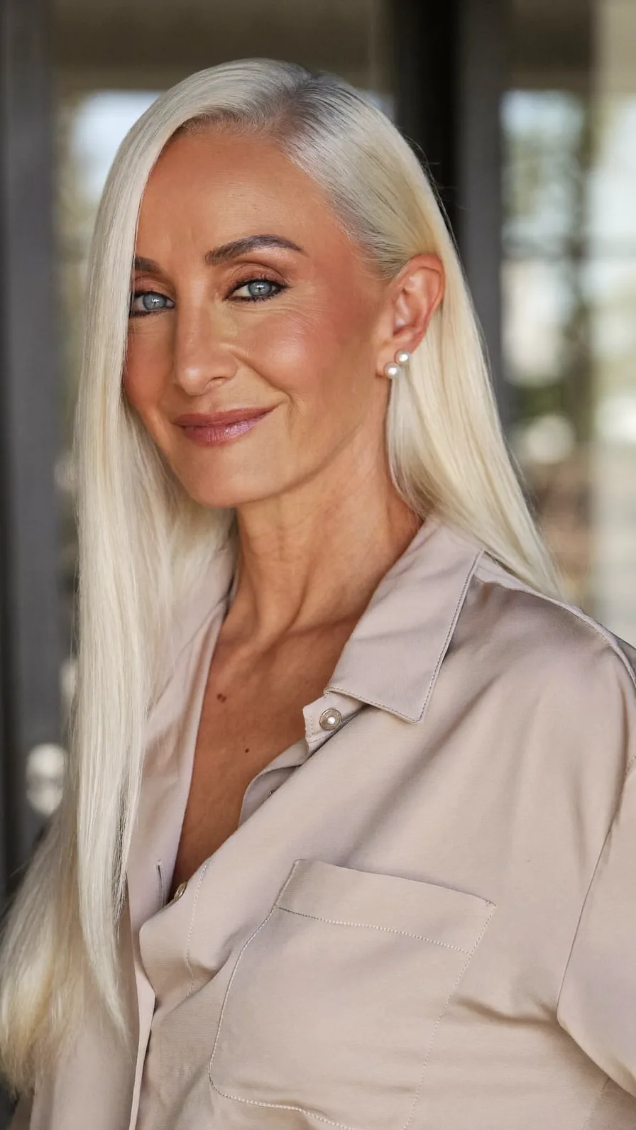 Elegant Sleek Platinum Blonde Long Layers Hairstyle